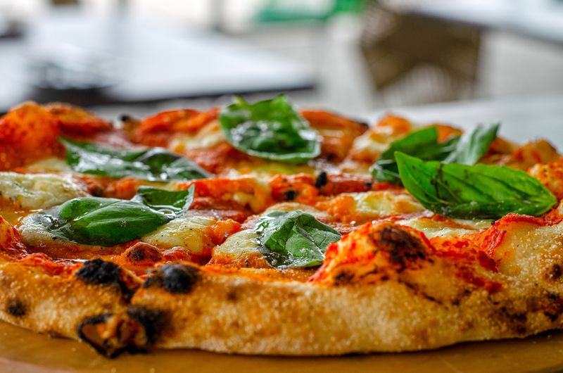 Papa Ginos classic Margherita pizza with fresh basil and mozzarella